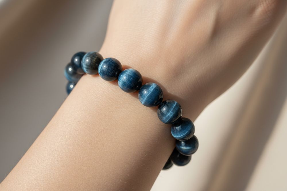 blue tiger's eye gemstone bracelet on a woman's wrist